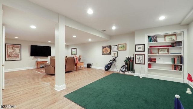 workout area featuring light wood-type flooring