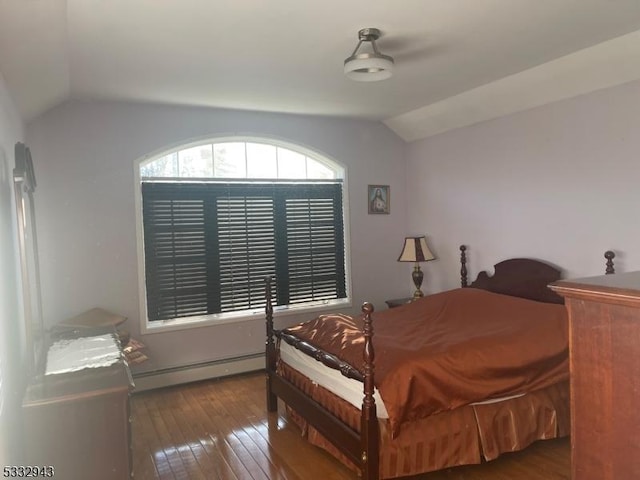 bedroom featuring vaulted ceiling, a baseboard radiator, and dark hardwood / wood-style floors