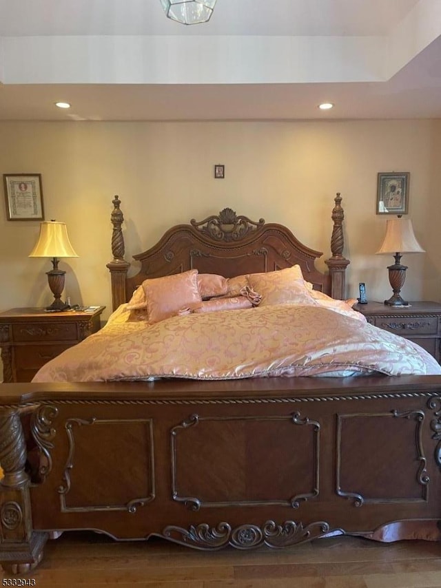 bedroom with dark wood-type flooring