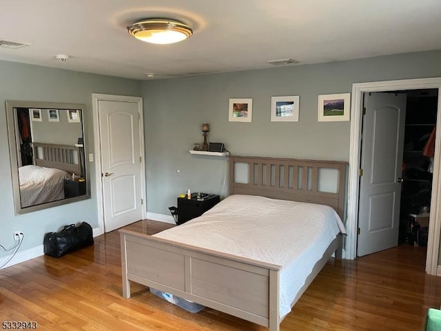 bedroom featuring hardwood / wood-style flooring