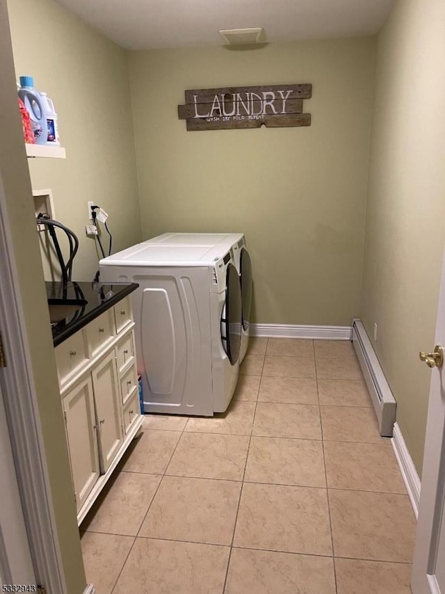 washroom with separate washer and dryer, light tile patterned flooring, and a baseboard radiator