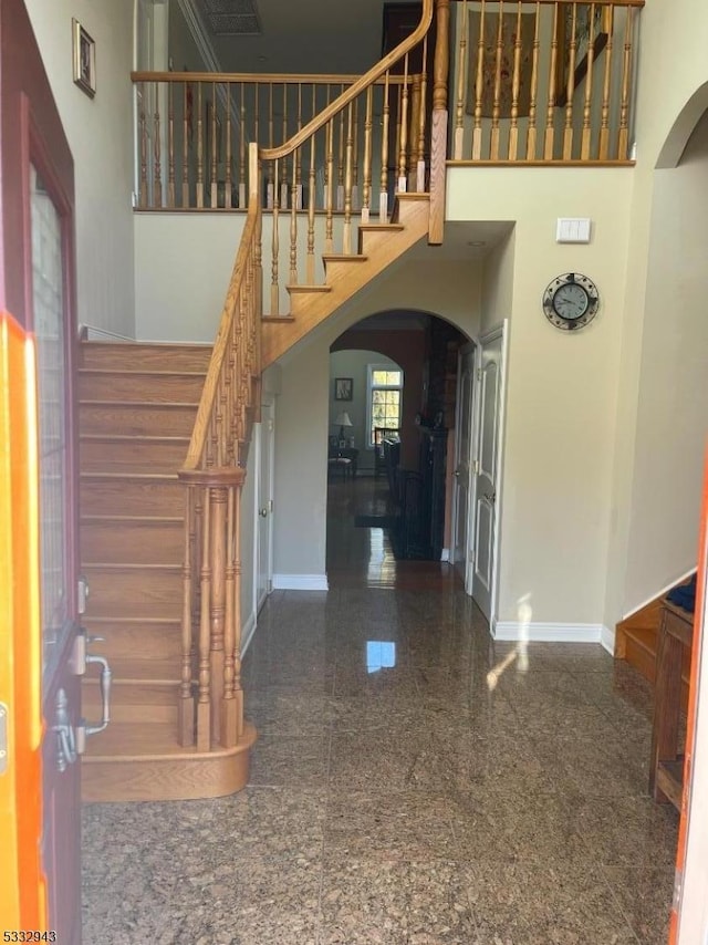 entryway with a high ceiling