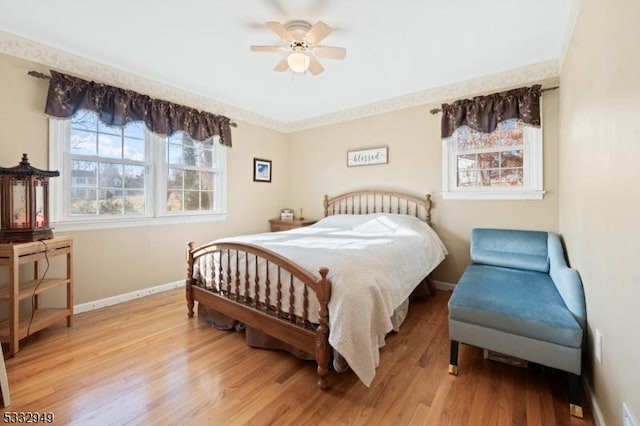 bedroom featuring light wood-type flooring and ceiling fan