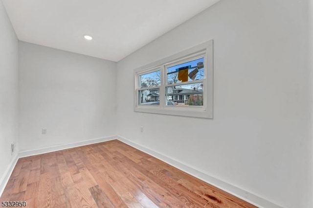 empty room with light hardwood / wood-style floors