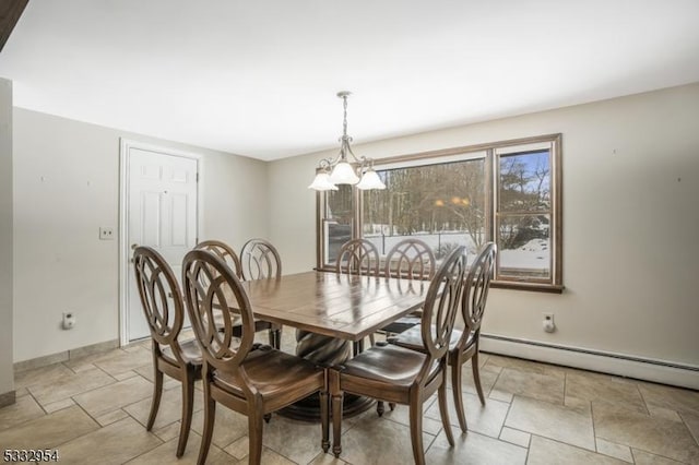 dining area with an inviting chandelier and baseboard heating