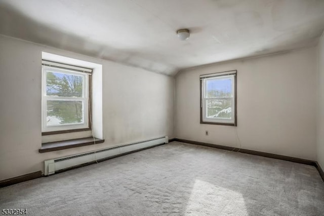 bonus room featuring a baseboard radiator, plenty of natural light, carpet flooring, and lofted ceiling