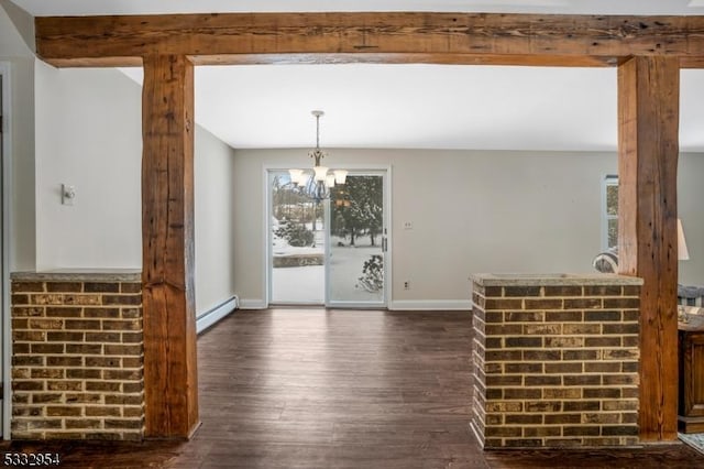 unfurnished dining area with baseboard heating, a notable chandelier, and dark hardwood / wood-style flooring