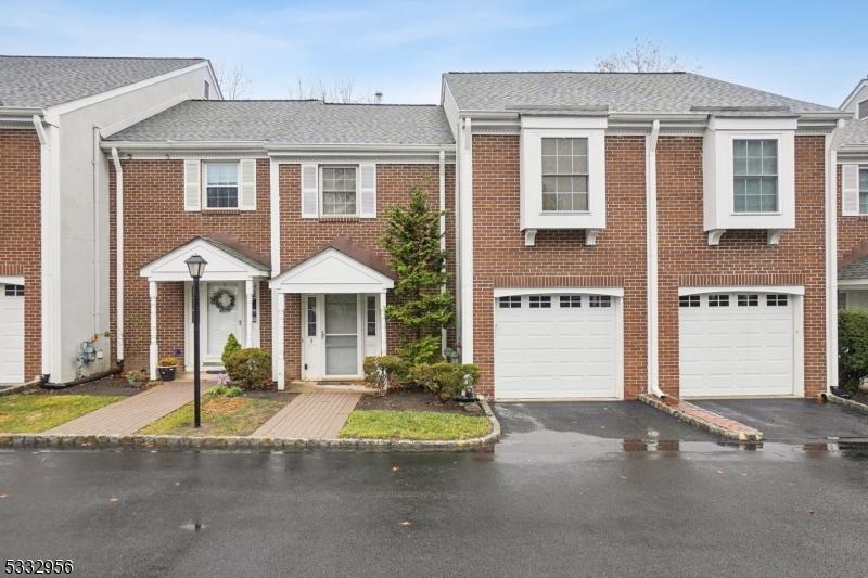 townhome / multi-family property featuring a garage