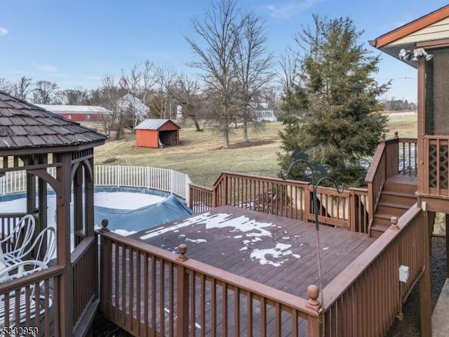 wooden terrace featuring a yard