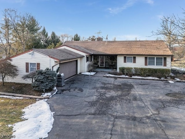 ranch-style home with a garage