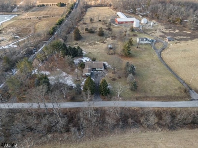 birds eye view of property with a rural view