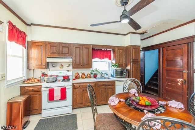 kitchen featuring sink, white appliances, light tile patterned floors, ceiling fan, and ornamental molding