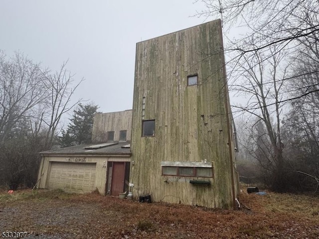 view of side of property featuring a garage