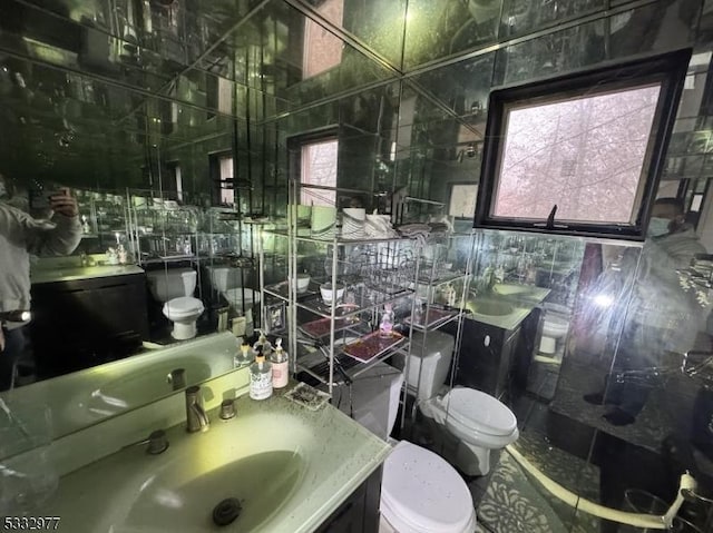 bathroom with tile walls and vanity