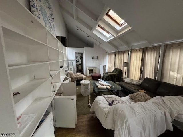 interior space with vaulted ceiling with skylight