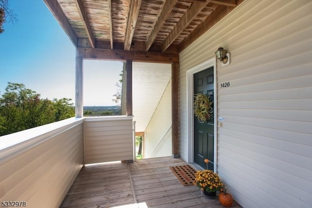 entrance to property featuring a balcony