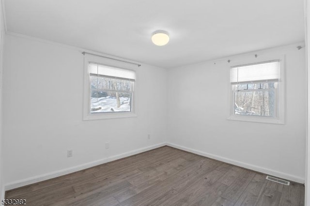 empty room featuring wood-type flooring