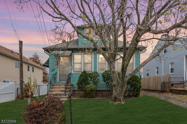 view of front of home with a lawn