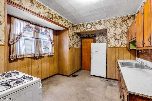 kitchen featuring sink and white appliances