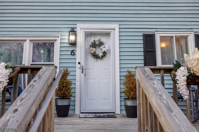 doorway to property featuring a wooden deck