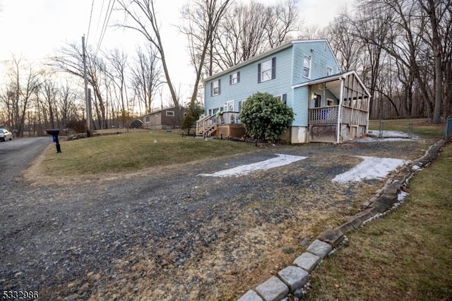 view of property exterior with a lawn