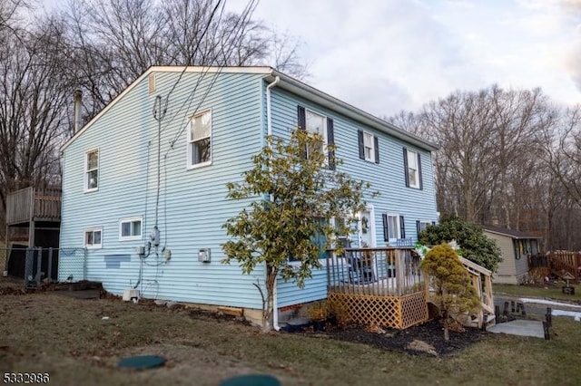 view of side of home featuring a deck