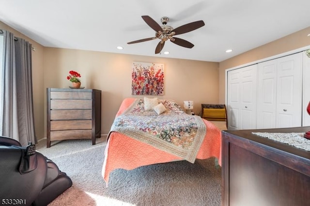 bedroom with ceiling fan, a closet, and carpet flooring