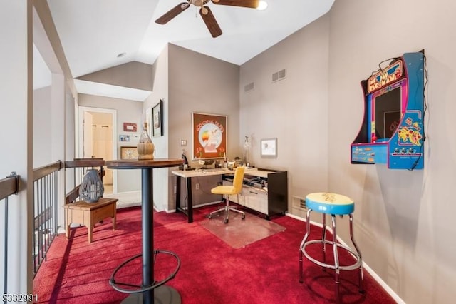 carpeted home office with vaulted ceiling and ceiling fan