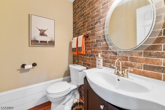 bathroom featuring toilet and vanity