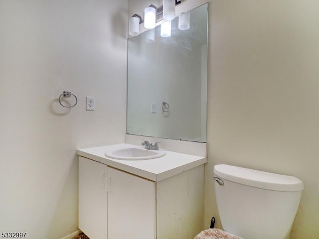 bathroom with toilet and vanity