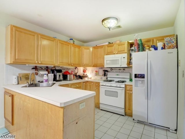 kitchen featuring white appliances, kitchen peninsula, light brown cabinets, decorative backsplash, and sink