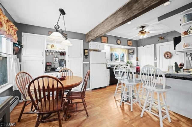 dining room featuring ceiling fan, baseboard heating, beamed ceiling, and light hardwood / wood-style floors