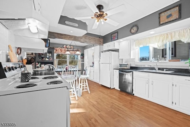 kitchen featuring ceiling fan, sink, white cabinets, and white appliances