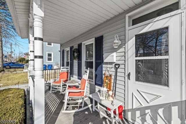 wooden deck featuring covered porch