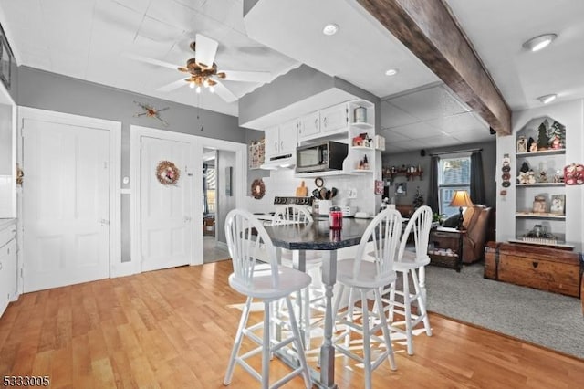 dining room featuring ceiling fan and light hardwood / wood-style flooring