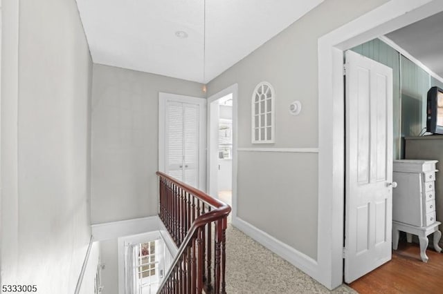 hallway featuring carpet