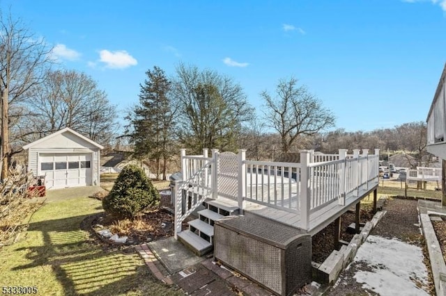 wooden deck featuring an outbuilding, a yard, and a garage