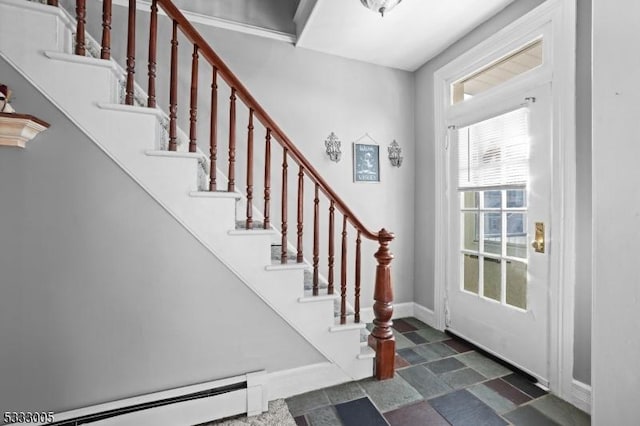 foyer featuring a baseboard heating unit