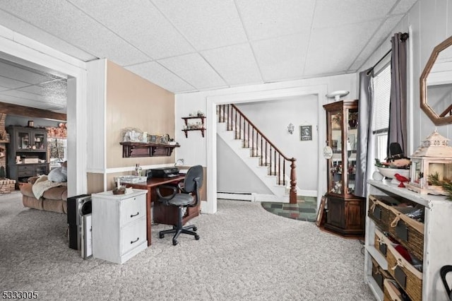 office featuring a paneled ceiling, carpet flooring, and baseboard heating