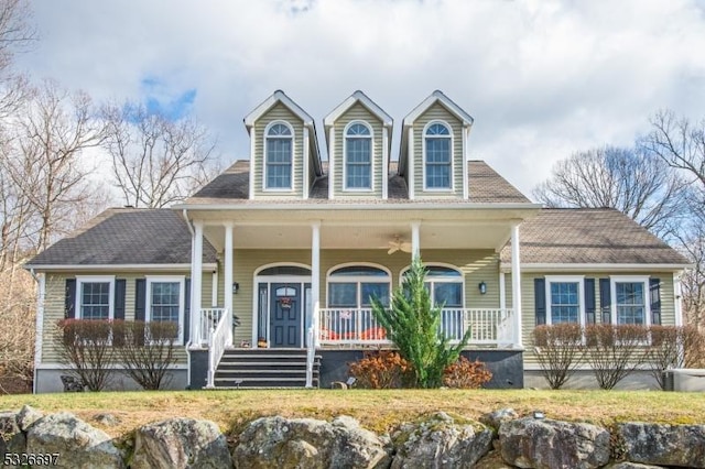 new england style home with a porch