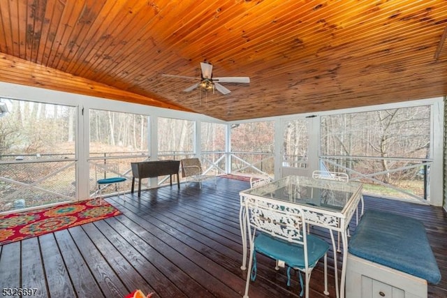 sunroom with ceiling fan, wooden ceiling, and vaulted ceiling