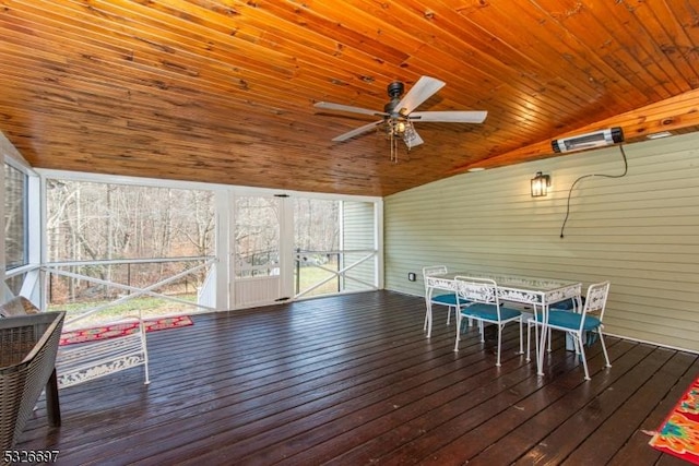 unfurnished sunroom featuring lofted ceiling, ceiling fan, and wood ceiling