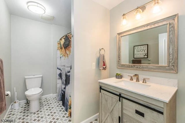 bathroom with toilet and vanity