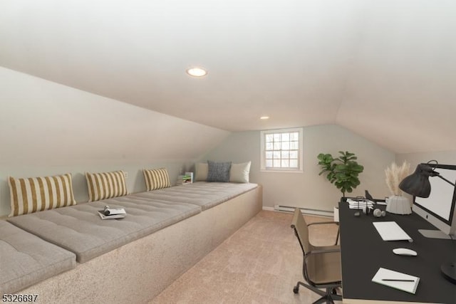 carpeted bedroom with a baseboard heating unit and vaulted ceiling