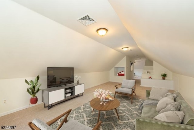 living room with carpet and vaulted ceiling