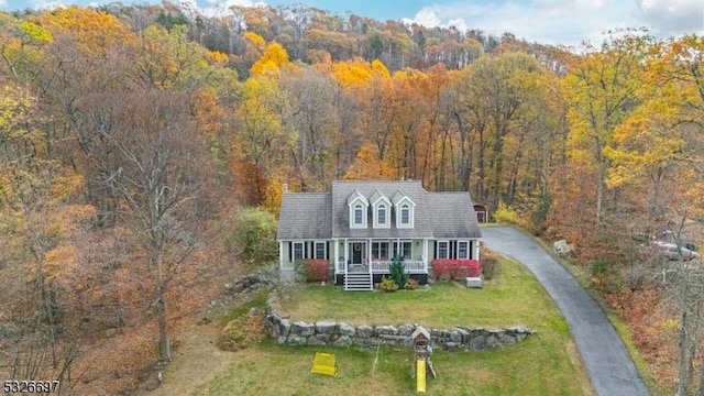 view of front of home featuring a porch and a front yard