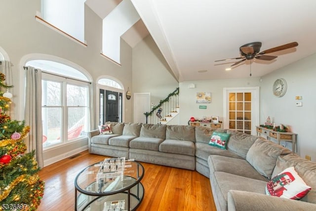 living room featuring light hardwood / wood-style floors and ceiling fan