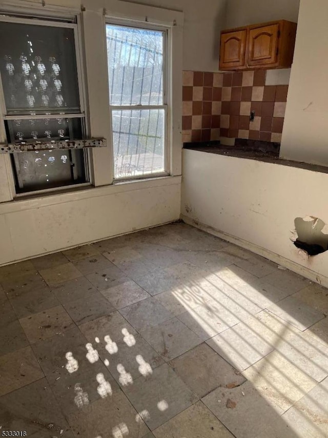 unfurnished dining area featuring a healthy amount of sunlight