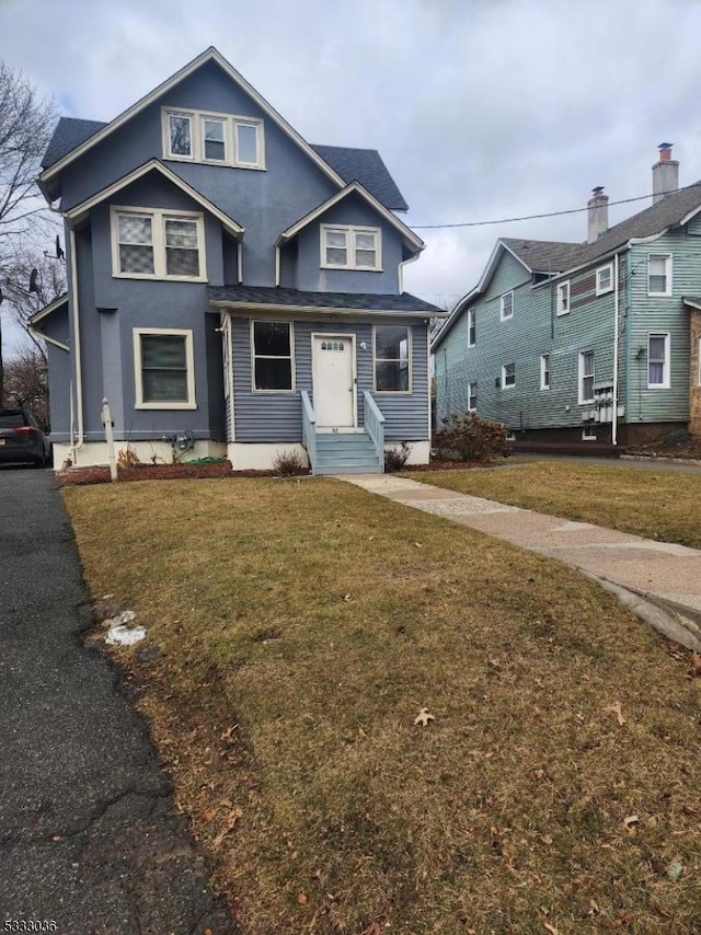 view of front of property with a front lawn