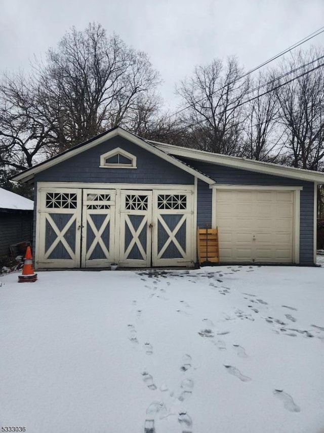 view of snow covered garage